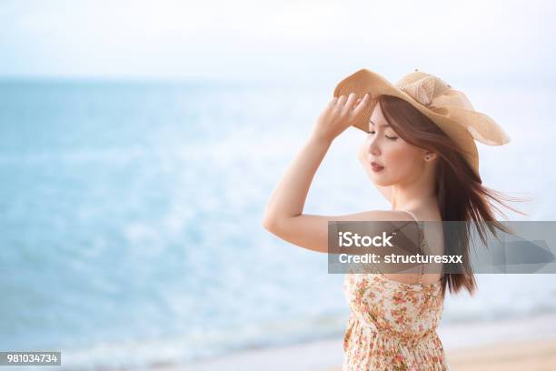 Young Asian Woman With Hat Enjoying At The Beach Summervacation And Holiday Concept Stock Photo - Download Image Now
