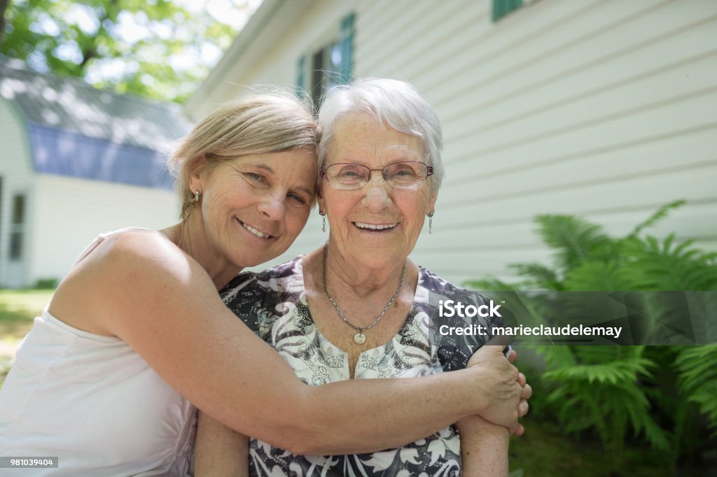 Complicity between mother and daughter Sweet family Senior Adult Stock Photo