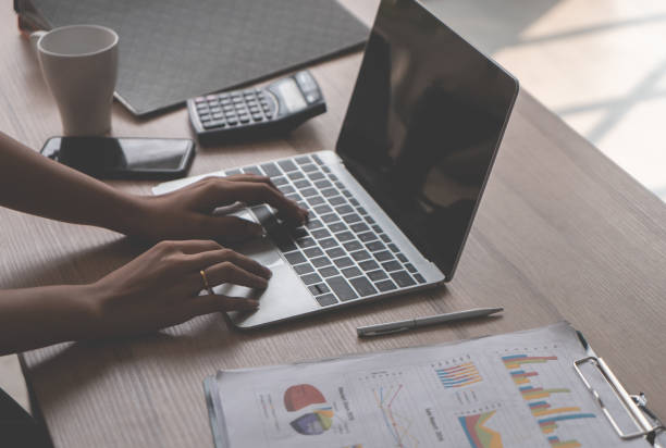 istock Office woman hand is typing on business computer 981043106