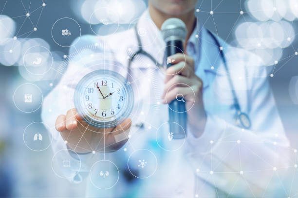 istock Doctor speaker shows the importance of time . 981054354