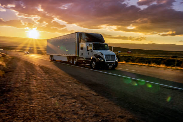 istock Semi-Truck on an Interstate Highway at Dusk with Cloudscape 981057804