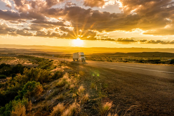 istock Semi-Truck on an Interstate Highway at Dusk with Cloudscape 981057848