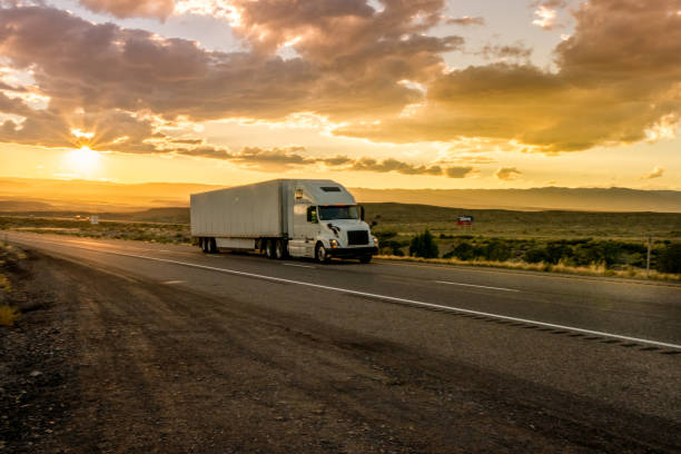 istock Semi-Truck on an Interstate Highway at Dusk with Cloudscape 981057866