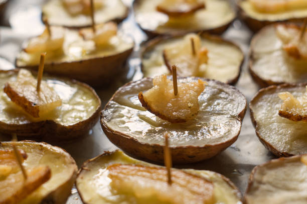 istock Potato halves baked with lard slices 981058472