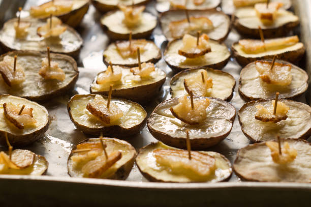 istock Potato halves baked with lard slices 981058512