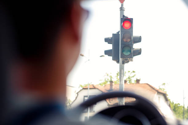 istock Traffic light with red light on a street. Street background 981068274