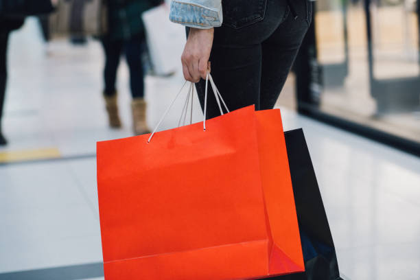 istock Shopping bags in female hand 981069182