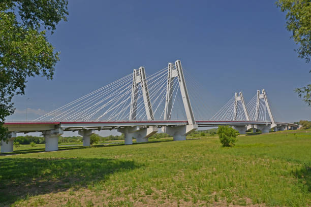 istock Bridge across the river in the sunny day 981080240
