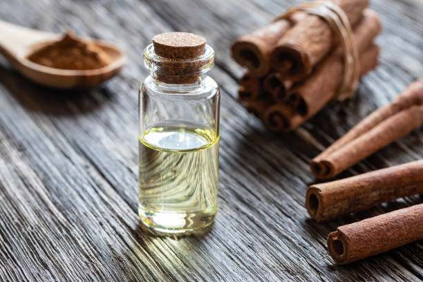 istock A bottle of cinnamon essential oil with cinnamon bark 981087910