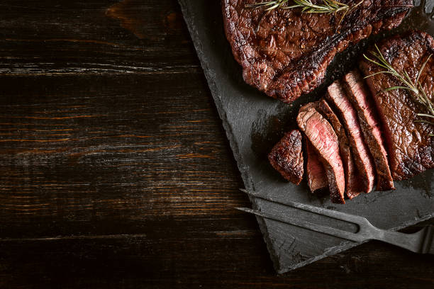 steaks from fresh meat dinner for two with steaks and red wine grilled stock pictures, royalty-free photos & images