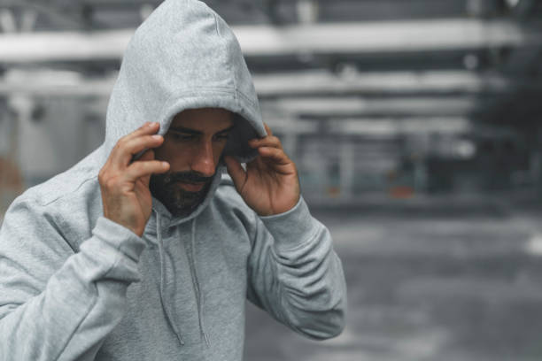 istock Athletic Man Resting after Exercising in an Abandoned Warehouse 981097308