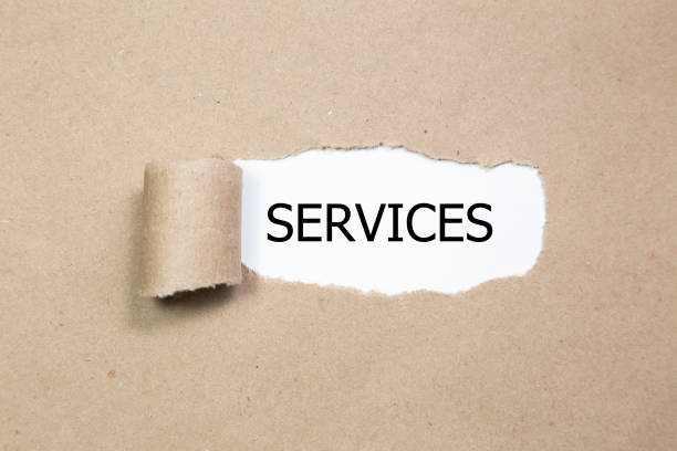 istock The word services appearing behind torn paper 981097440