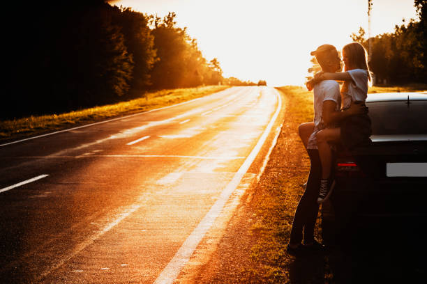 istock Couple at car hugging at sunset 981097956