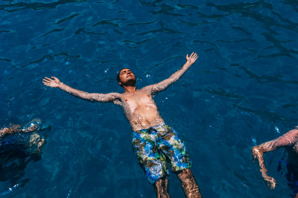 istock Young Man Enjoying in the Sea 981107916