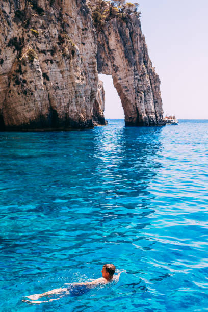 Young Man Swimming in Beautiful Sea.