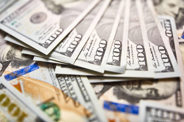 istock Background with money american hundred dollar bills 981109470