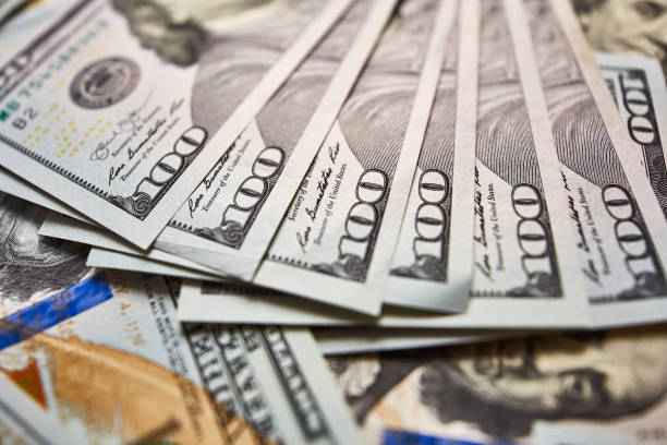 istock Background with money american hundred dollar bills 981109844