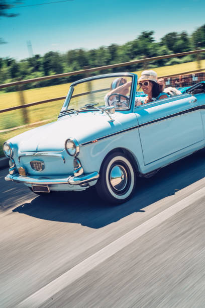 istock Two Mature Women on Roadtrip with Old-fashioned Car 981120350