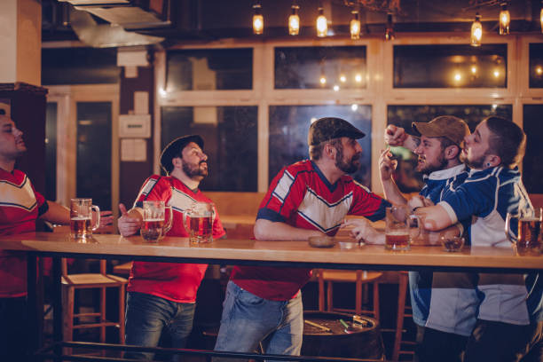 istock Group of men fighting in bar 981160080
