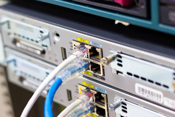 Network switch in rack, network cables connect SFP module port in the Datacenter room