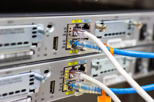 Network switch in rack, network cables connect SFP module port in the Datacenter room