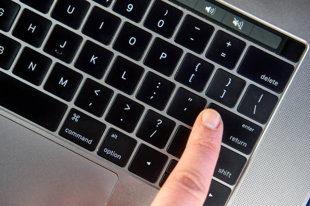 istock working on the laptop , work on the notebook Women finger click enter button on keyboard , Man finger click enter or return button on keyboard Working concept 981174130