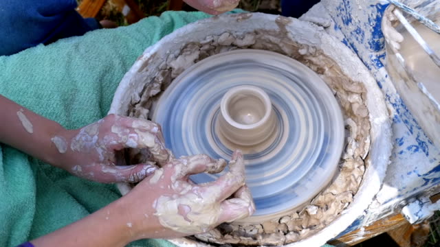 Potter's Hands Work with Clay on a Potter's Wheel. Slow Motion