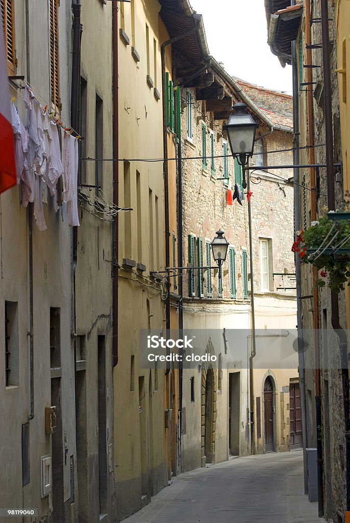 Old street in Sansepolcro (Tuscany) Sansepolcro (Arezzo, Tuscany, Italy) - Old typical street turning to right. Architecture Stock Photo