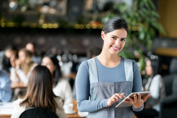 istock Happy waitress working at a restaurant 981193814