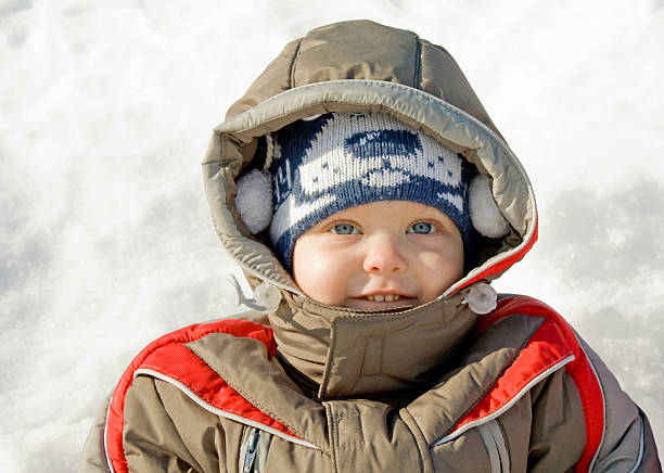 boy against snow stock photo