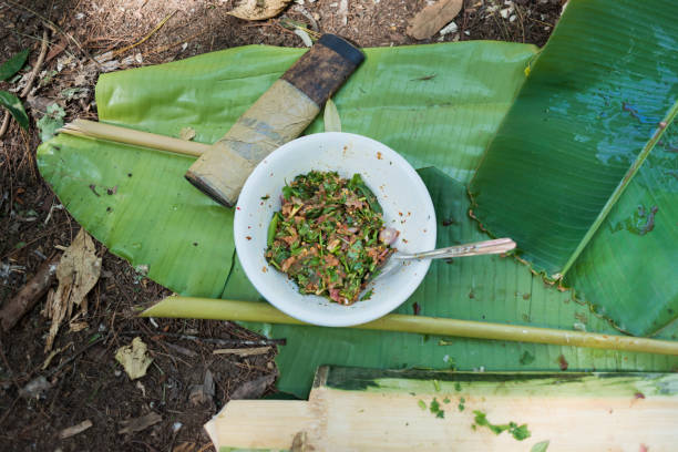 istock Bowl with fish salad on banana leaf 981194412