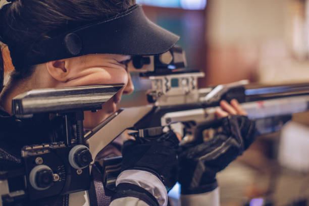 istock Beautiful girl at shooting range 981212566