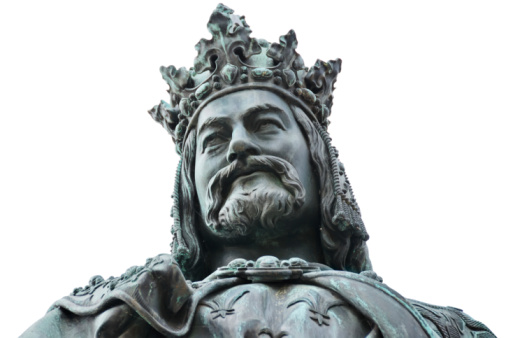 Statue of King Charles IV on Cross Square, near Charles bridge in Prague. This is a bronze Neo-Gothic statue unveiled in 1848 in honour of the 500th anniversary of the founding of Prague's Carolinum University.  Close up shot isolated on white background.