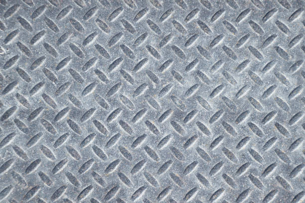 istock Weathered Industrial Checker Plate Background Texture with Rusty Worn Embossed Raised Diamond Pattern Wallpaper 981235838