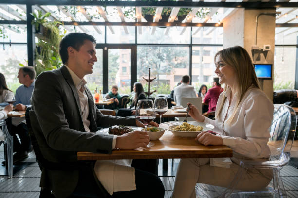 istock Happy couple eating together at a restaurant 981235922