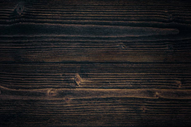 istock Dark brown wood texture with natural striped pattern background 981242954
