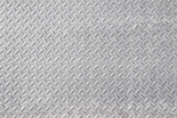 Weathered Industrial Checker Plate Background Texture with Rusty Worn Embossed Raised Diamond Pattern Wallpaper