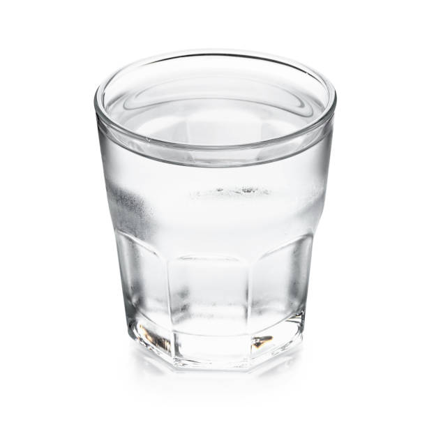 istock Pure water in glass isolated on a white background 981250124