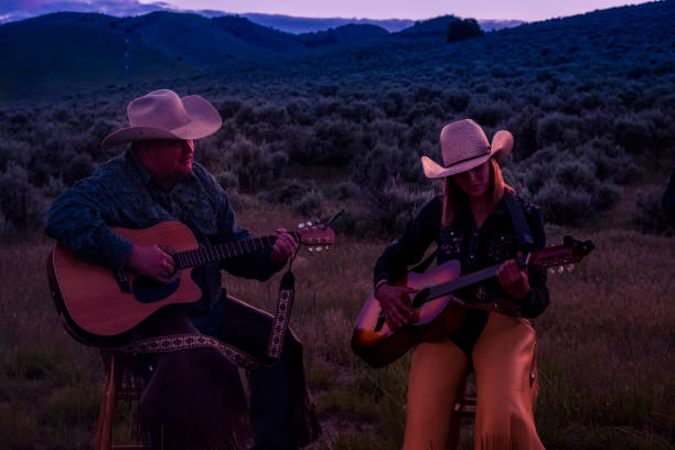 istock Western Family Having A Campfire And Sing Along 981250172