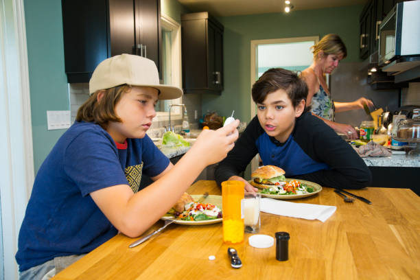 istock A family with a diabetic son helping him check his blood sugar. 981253168