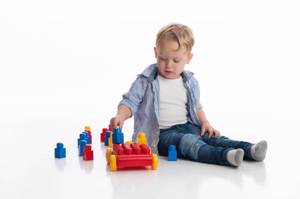 Boy Playing with Building Blocks stock photo