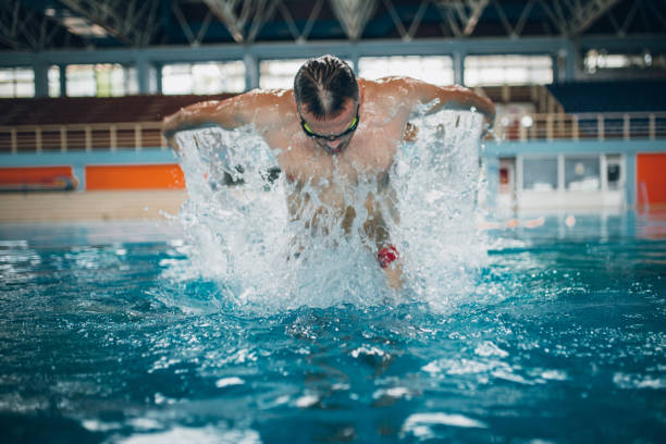 istock Mature adult man swimming 981264720