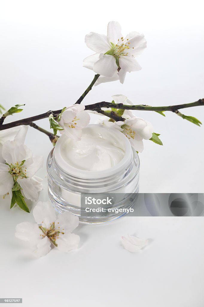 Face cream and almond flowers  Beauty Treatment Stock Photo