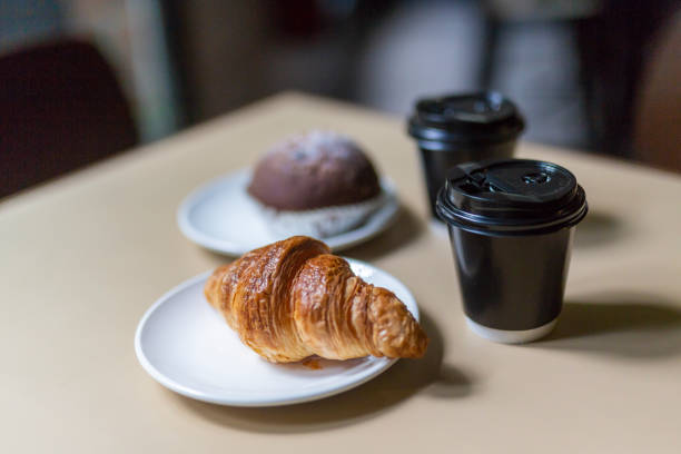 istock Coffee and Croissants on the Table of a Restaurant or Cafe 981285672