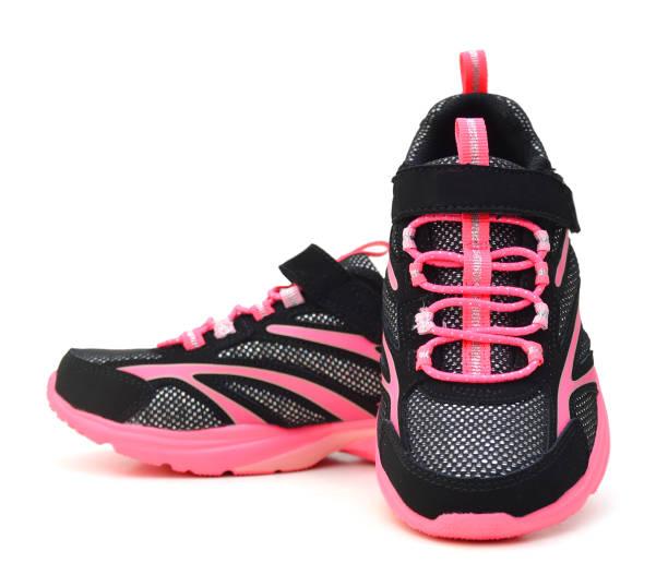 istock pink sport shoes on white background 981298558