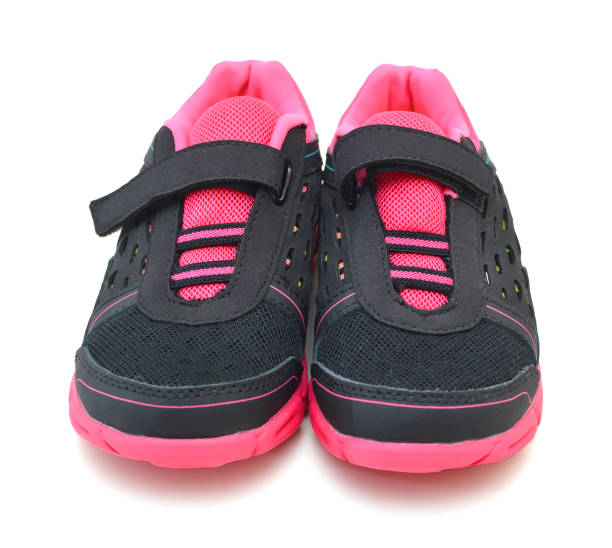 istock pink sport shoes on white background 981299538