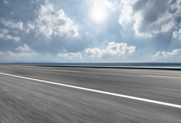 istock Empty asphalt road and blue sea nature landscape at sunset 981306112