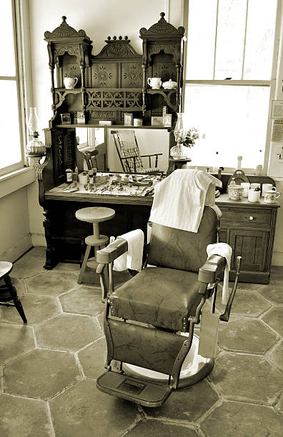 Stylish Vintage Barber Chair In brick wall Interior. Barbershop Theme. Barbershop armchair. Modern hairdresser and hair salon, barber shop for men