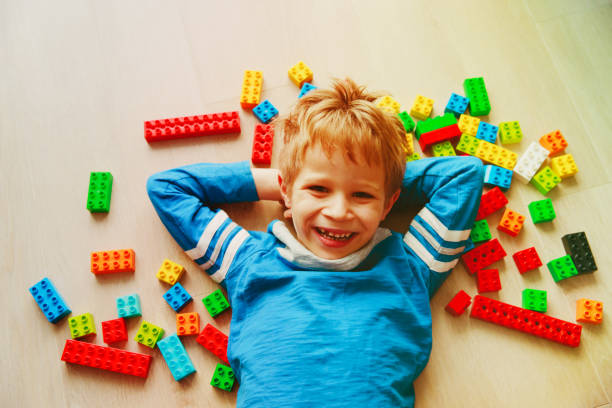 istock cute little boy love play with plastic blocks 981311066