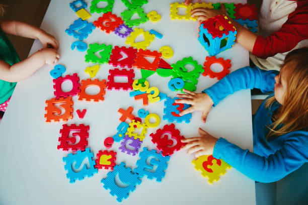 istock kids playing with number and shapes puzzle 981311294